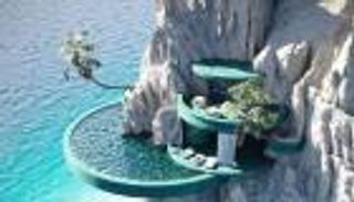 فندق داخل صخرة في إيطاليا.. قصة صورة خدعت الآلاف