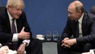 بوتين وجونسون في لقاء سابق