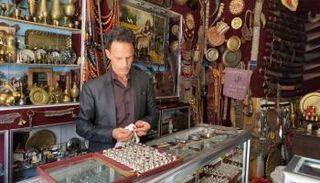 عبدالله العريفي داخل متجره في تعز