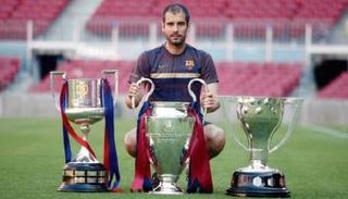 غوارديولا مع ثلاثية برشلونة في 2009