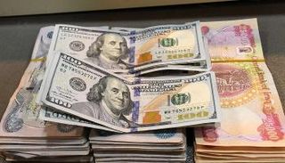 الدينار العراقي مقابل الدولار الأمريكي - أرشيفية 
