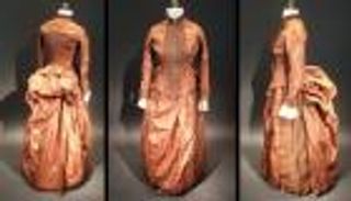 حل لغز كلمات غامضة مخبأة داخل فستان حريري عمره 136 عاما