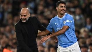 رودري وغوارديولا في مانشستر سيتي