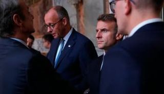 ماكرون ومستشار ألمانيا خلال قمة سابقة