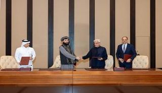 جانب من مراسم توقيع الاتفاق في الدوحة