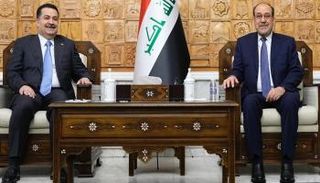 محمد شياع السوداني (يسار) ونوري المالكي (يمين)