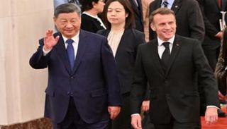 جانب من لقاء ماكرون وشي