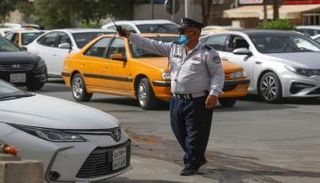 شرطي مرور ينقذ طفلا مريضا في العراق- أرشيفية