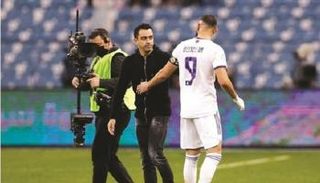 تشافي هيرنانديز وكريم بنزيما