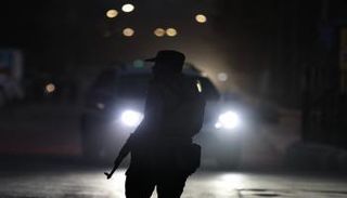 ، أحد أفراد قوات الأمن المنتشرة قرب حيّي الشيخ مقصود والأشرفية في حلب