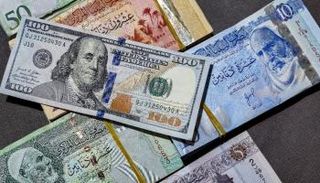 الدولار الأمريكي والدينار الليبي